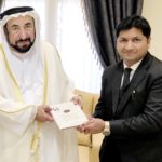 Mujeeb Jaihoon presents SLOGANS OF THE SAGE to Dr. Sheikh Sultan, ruler of Sharjah